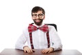 Young old fashioned man sitting by a desk. Royalty Free Stock Photo