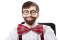 Young old fashioned man sitting by a desk. Royalty Free Stock Photo