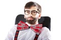 Young old fashioned man sitting by a desk. Royalty Free Stock Photo