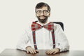 Young old fashioned man sitting by a desk. Royalty Free Stock Photo