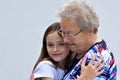 Me and grandma, girl embraces her granny
