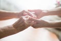 Young and old hands hold each other Royalty Free Stock Photo