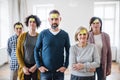 Young and old people standing with negative emotions adhesive notes during group therapy. Royalty Free Stock Photo