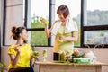 Young and older women with healthy food indoors