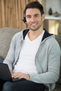 young operator call center with head-phones work with laptop Royalty Free Stock Photo