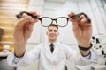 Young Optician Holding Glasses Royalty Free Stock Photo