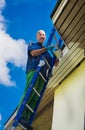 Young optimistic hipster renovates house Royalty Free Stock Photo