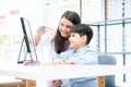 Young optometrist woman or doctor helping Indian cute child boy have fun trying and choosing a new eyeglasses frame at Royalty Free Stock Photo