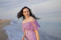 A girl with long hair looks at the sea. Royalty Free Stock Photo