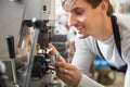 Handyman making door keys copies Royalty Free Stock Photo