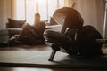 Young ordinary man go in for sport at home. Dark view on tired male preson after training sit on floor and rest Royalty Free Stock Photo