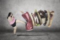 Young overweight woman kicking unhealthy foods