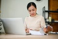 Young overwork stressful female working at her desk