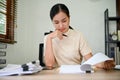 Young overwork stressful female working at her desk