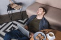 young overworked man sleeping on floor