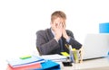 Young overworked and overwhelmed businessman covering his face suffering stress and headache Royalty Free Stock Photo