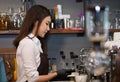 Young owner barista preparing machine at coffee shop,Preparation Service Concept. Royalty Free Stock Photo