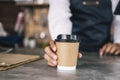 Young owner of coffee cafe service customer