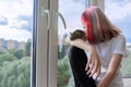 Young owner with pet and degu squirrel. Teenage girl looking out the window Royalty Free Stock Photo