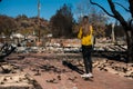 Woman looking at her burned home after fire disaster Royalty Free Stock Photo