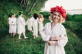 Young pagan Slavic girl conduct ceremony on Midsummer