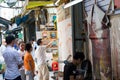 Young painter painting picture at the street