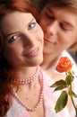 The young pair in love with rose Royalty Free Stock Photo