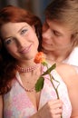 The young pair in love with rose Royalty Free Stock Photo