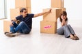 Young pair and many boxes in divorce settlement concept