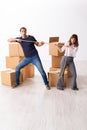 Young pair and many boxes in divorce settlement concept