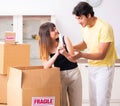 Young pair moving to new flat with fragile things