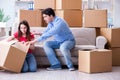 The young pair moving in to new house with boxes Royalty Free Stock Photo