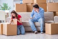 The young pair moving in to new house with boxes Royalty Free Stock Photo