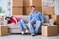 The young pair moving in to new house with boxes Royalty Free Stock Photo