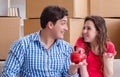 Young pair moving in to new house with boxes Royalty Free Stock Photo