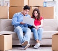 Young pair moving in to new house with boxes Royalty Free Stock Photo