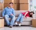 Young pair moving in to new house with boxes Royalty Free Stock Photo