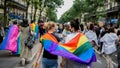 Young pair of women walking at an LGBT Pride parade in Paris