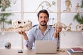 Young male paleontologist examining ancient animals at lab Royalty Free Stock Photo