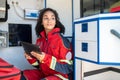 Young paramedic sitting in the medical emergency vehicle Royalty Free Stock Photo