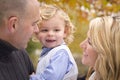 Young Parents and Child Portrait in Park