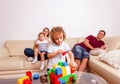 Parents with children having fun and playing together with toy blocks Royalty Free Stock Photo