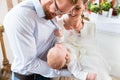 Parents with baby at christening in church