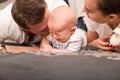 Young parents comfort her crying baby Royalty Free Stock Photo