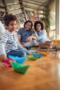 Young parents enjoying watching their little boy playing at home. Family, home, together, playtime Royalty Free Stock Photo