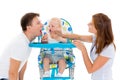 Young parents feed baby. Royalty Free Stock Photo