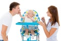 Young parents feed baby. Royalty Free Stock Photo