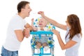 Young parents feed baby. Royalty Free Stock Photo