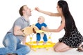 Young parents feed baby. Royalty Free Stock Photo