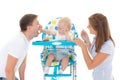 Young parents feed baby. Royalty Free Stock Photo